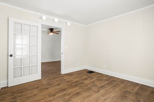 Bedroom with hardwood floors and a glass-paneled door at 52 North Lyon Street