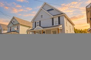 Golden-hour exterior of 52 North Lyon Street in Batavia, New York