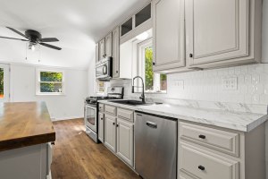 Updated kitchen cabinetry, counters, and stainless-steel appliances at 52 North Lyon Street
