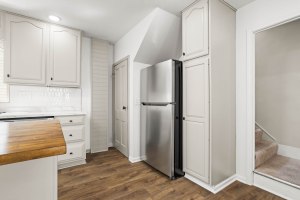 Kitchen storage and refrigerator area at 52 North Lyon Street in Batavia