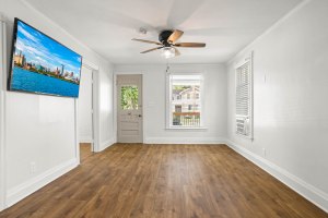 Bright living room with hardwood-look flooring at 52 North Lyon Street