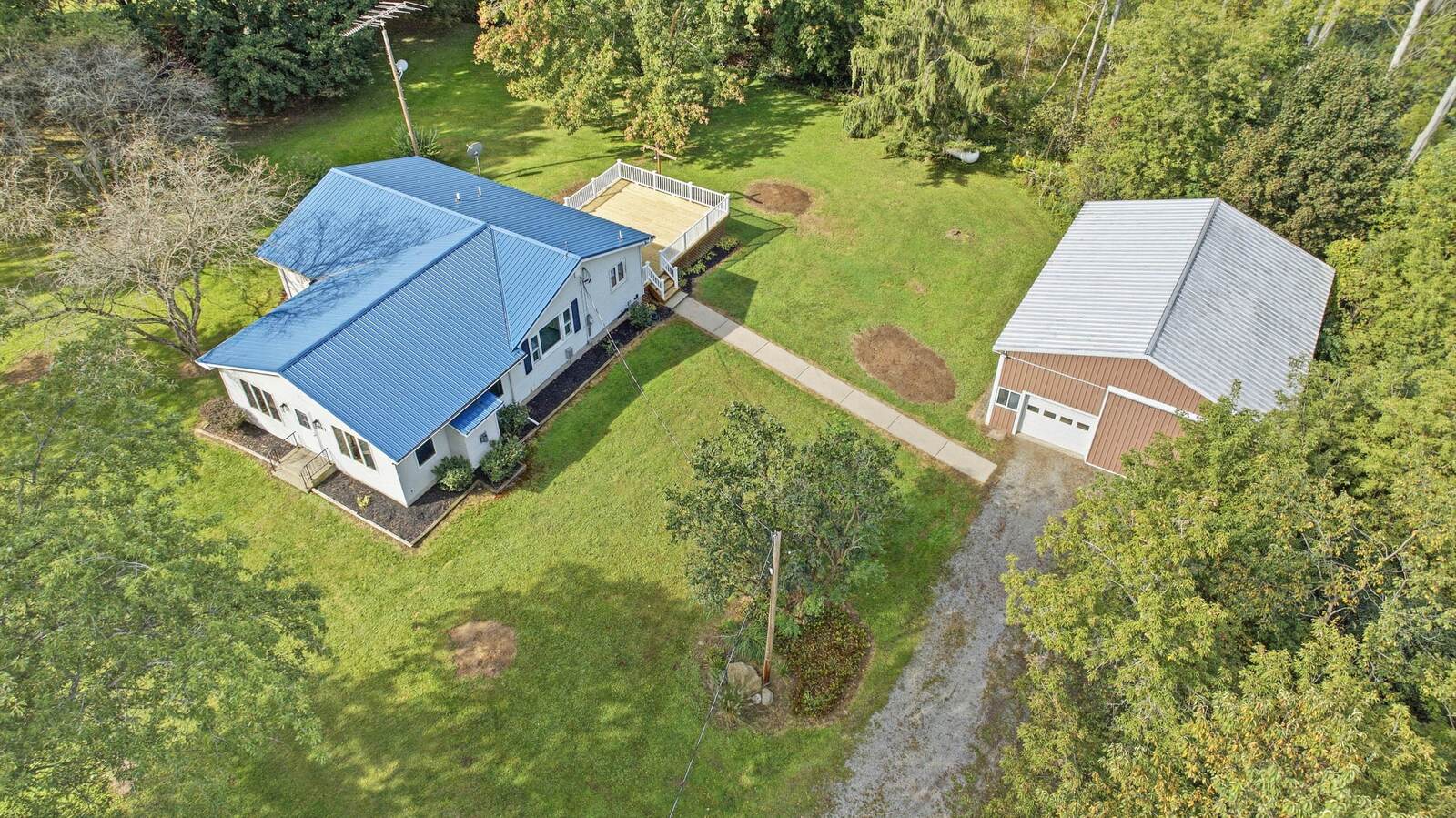 Aerial view of the home, barn and country setting