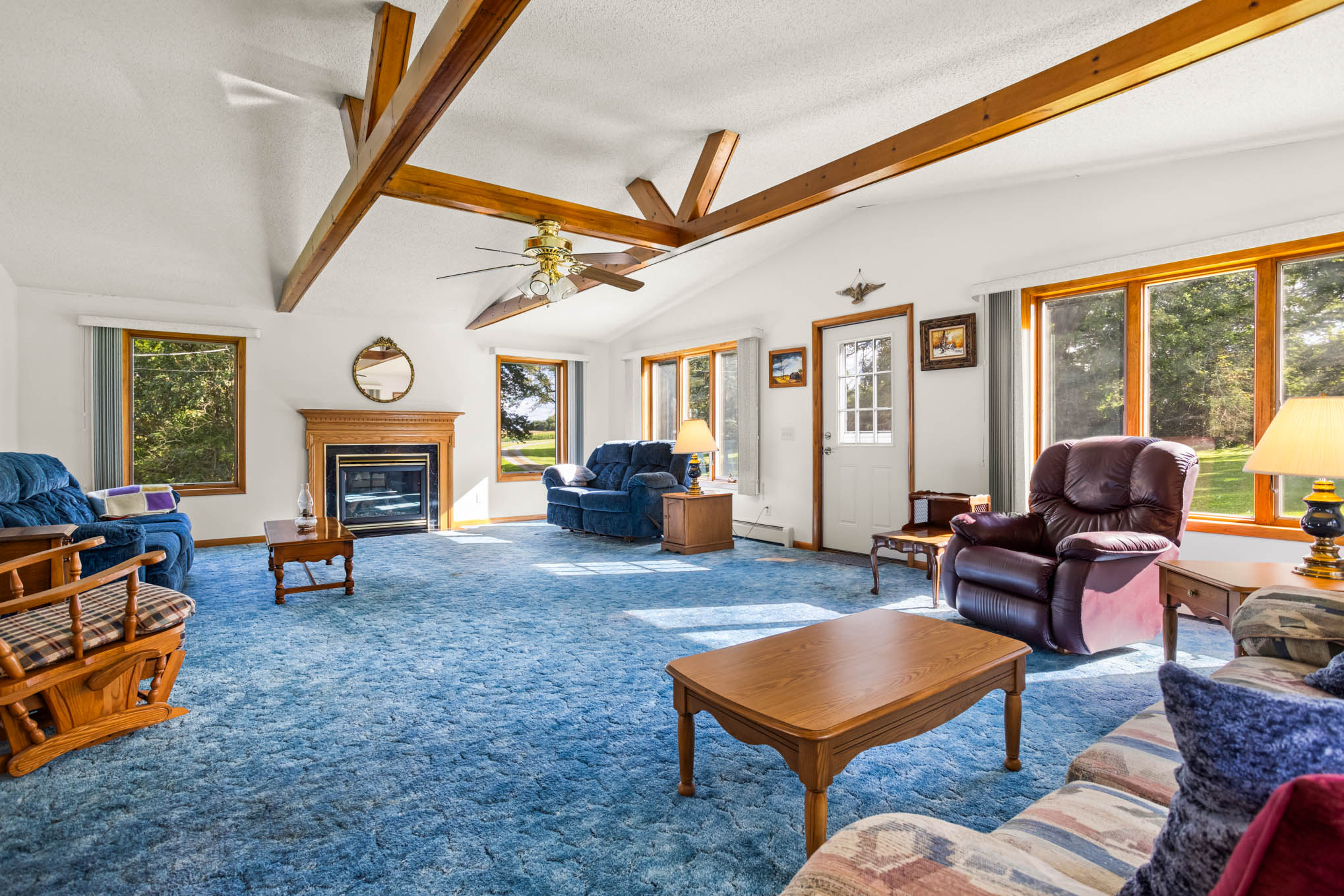 Great room with vaulted ceiling, wood beams and gas fireplace