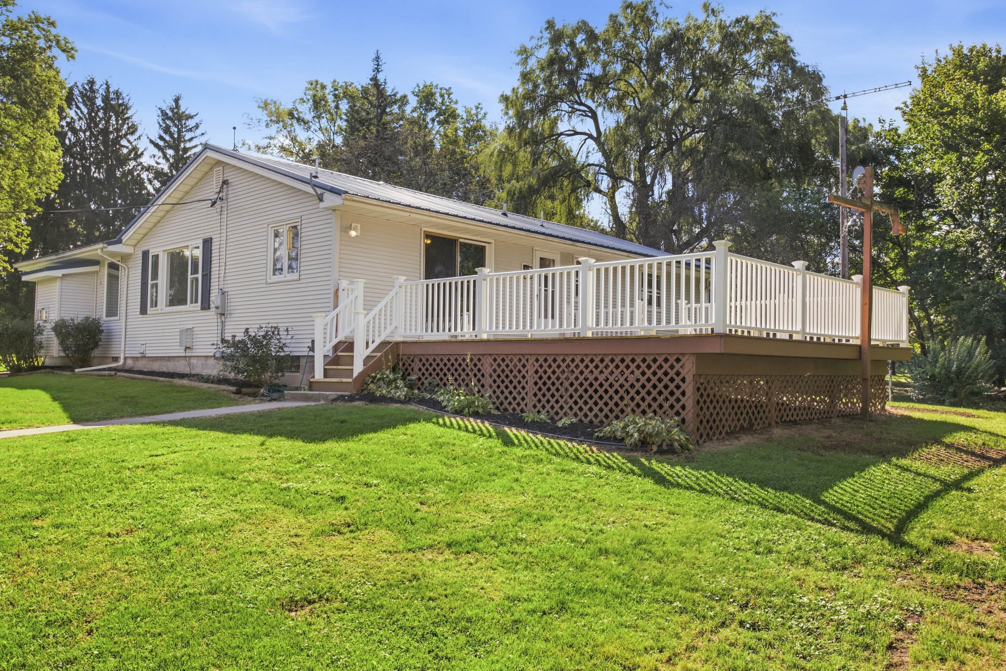 Rear exterior and back deck at 8082 Mill Road