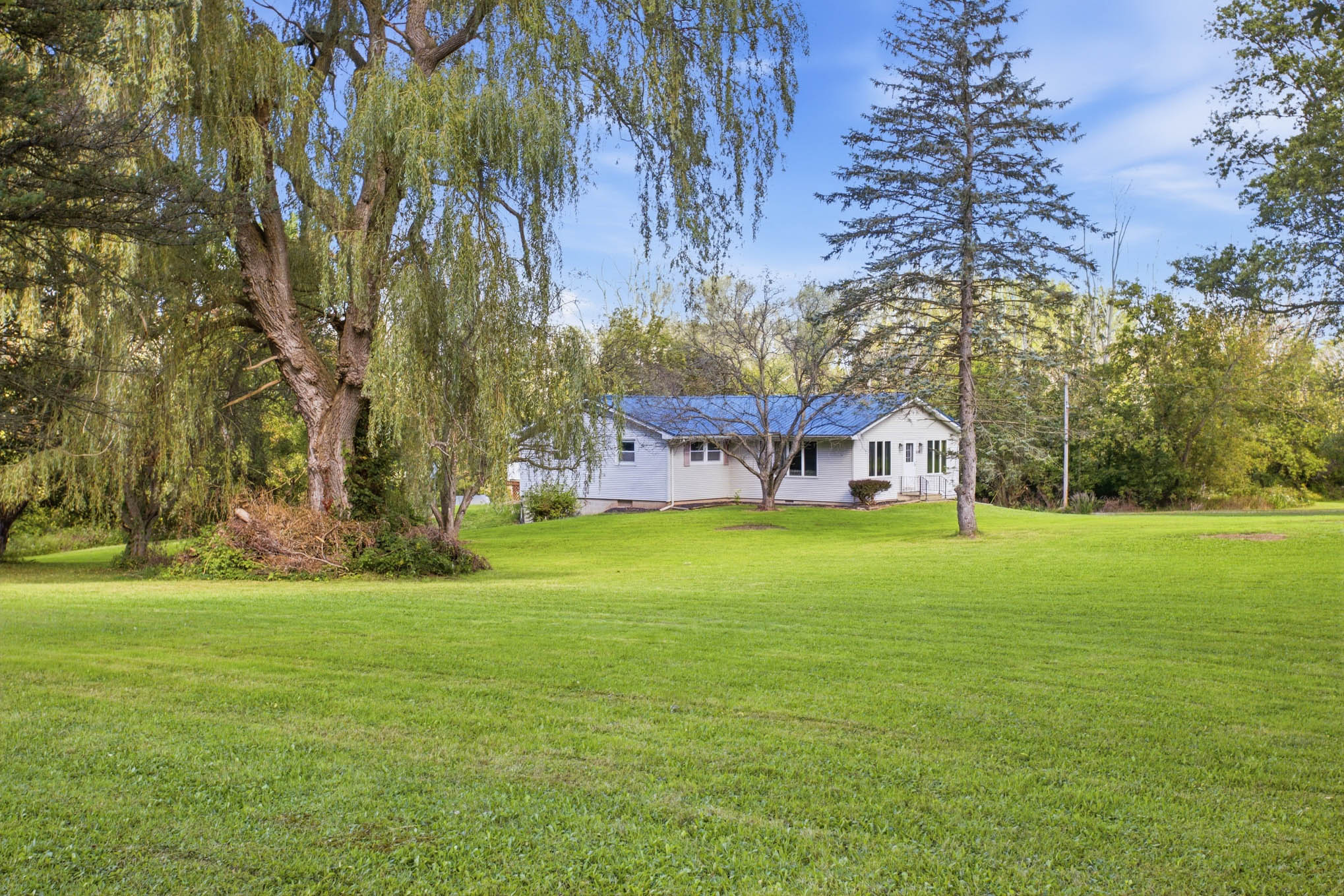 Open and wooded acreage surrounding 8082 Mill Road