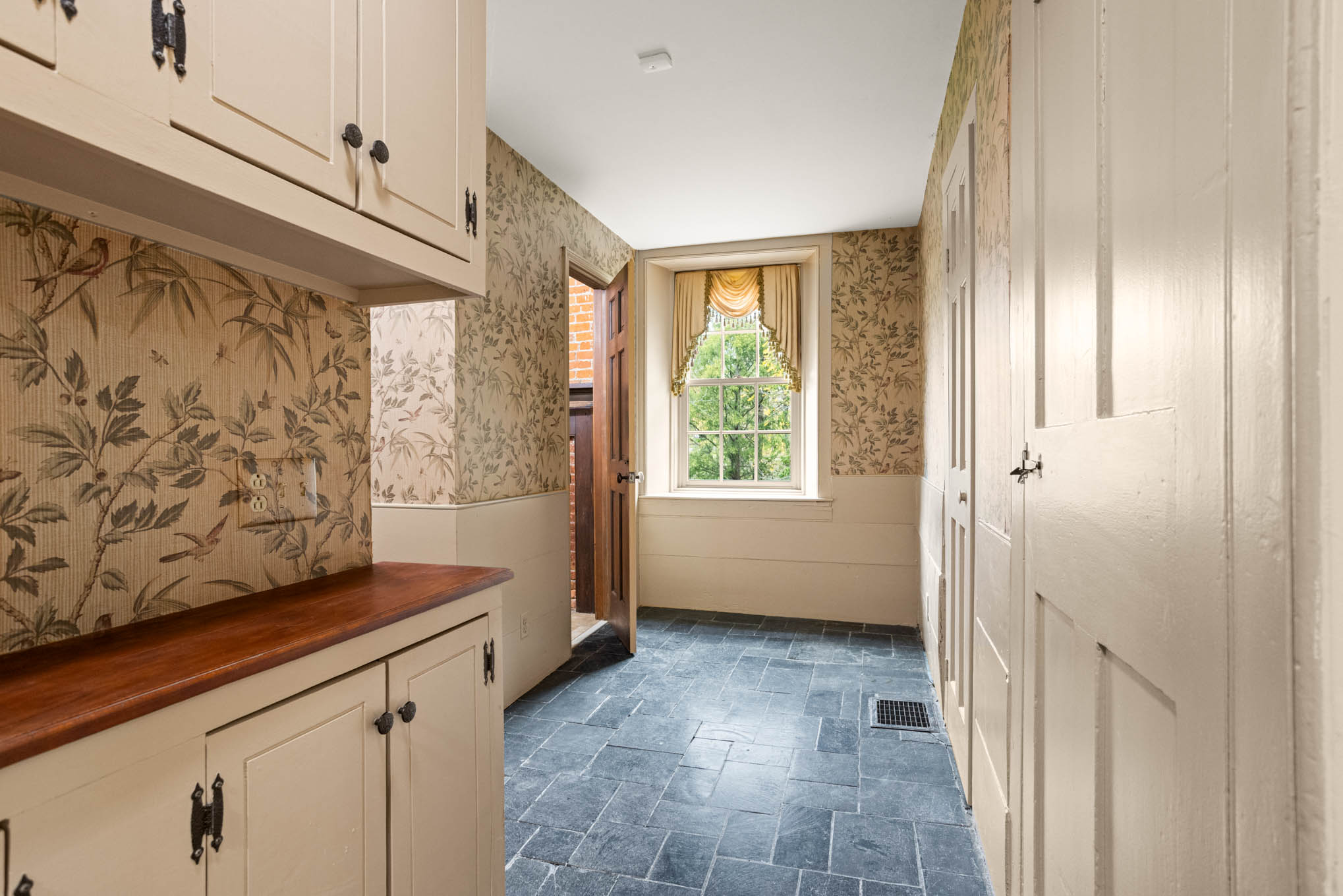 Hall with built-in cabinetry