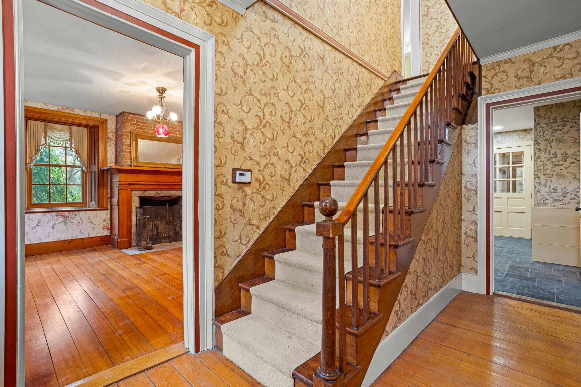 Entry staircase and adjoining room