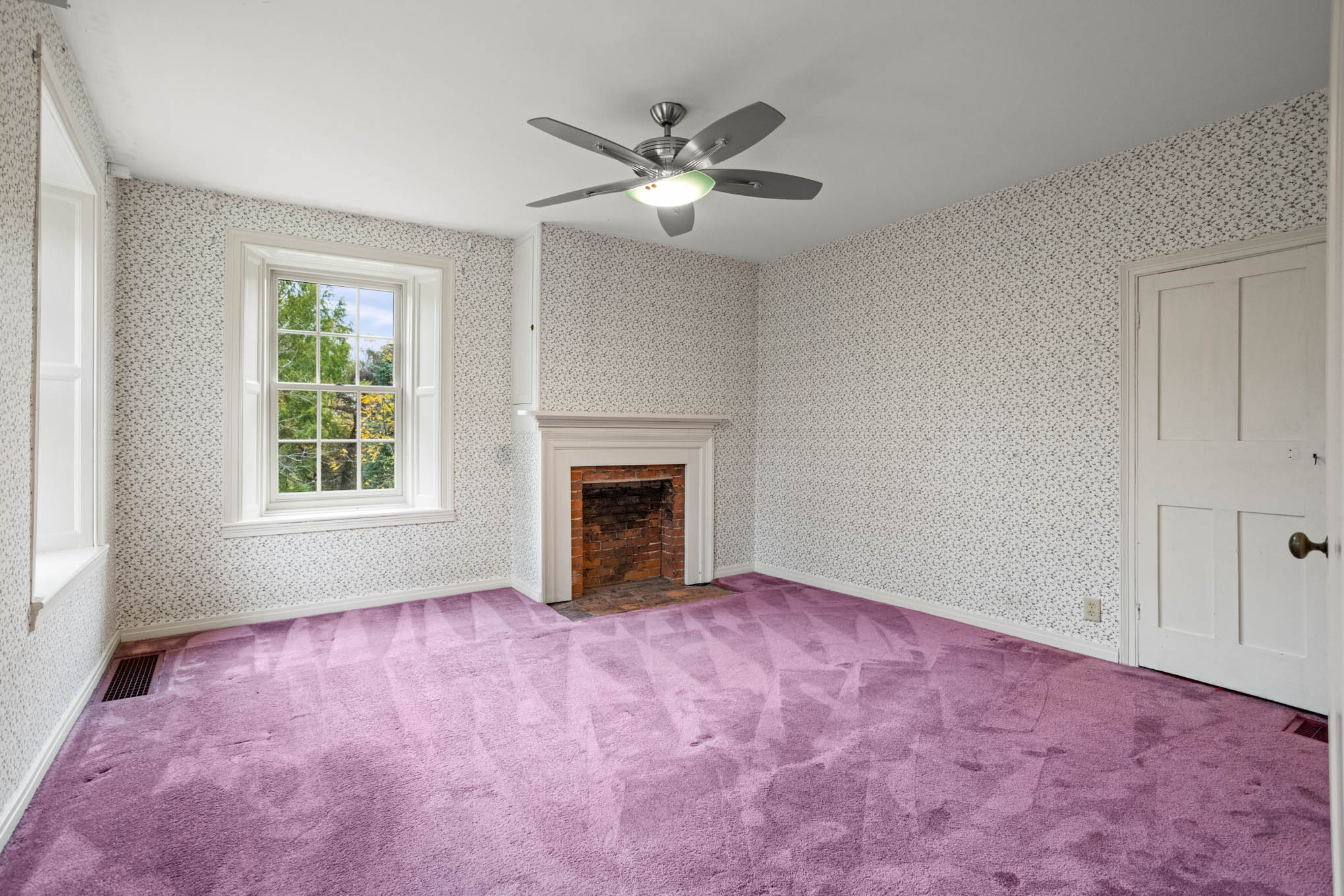 Bedroom with purple carpet