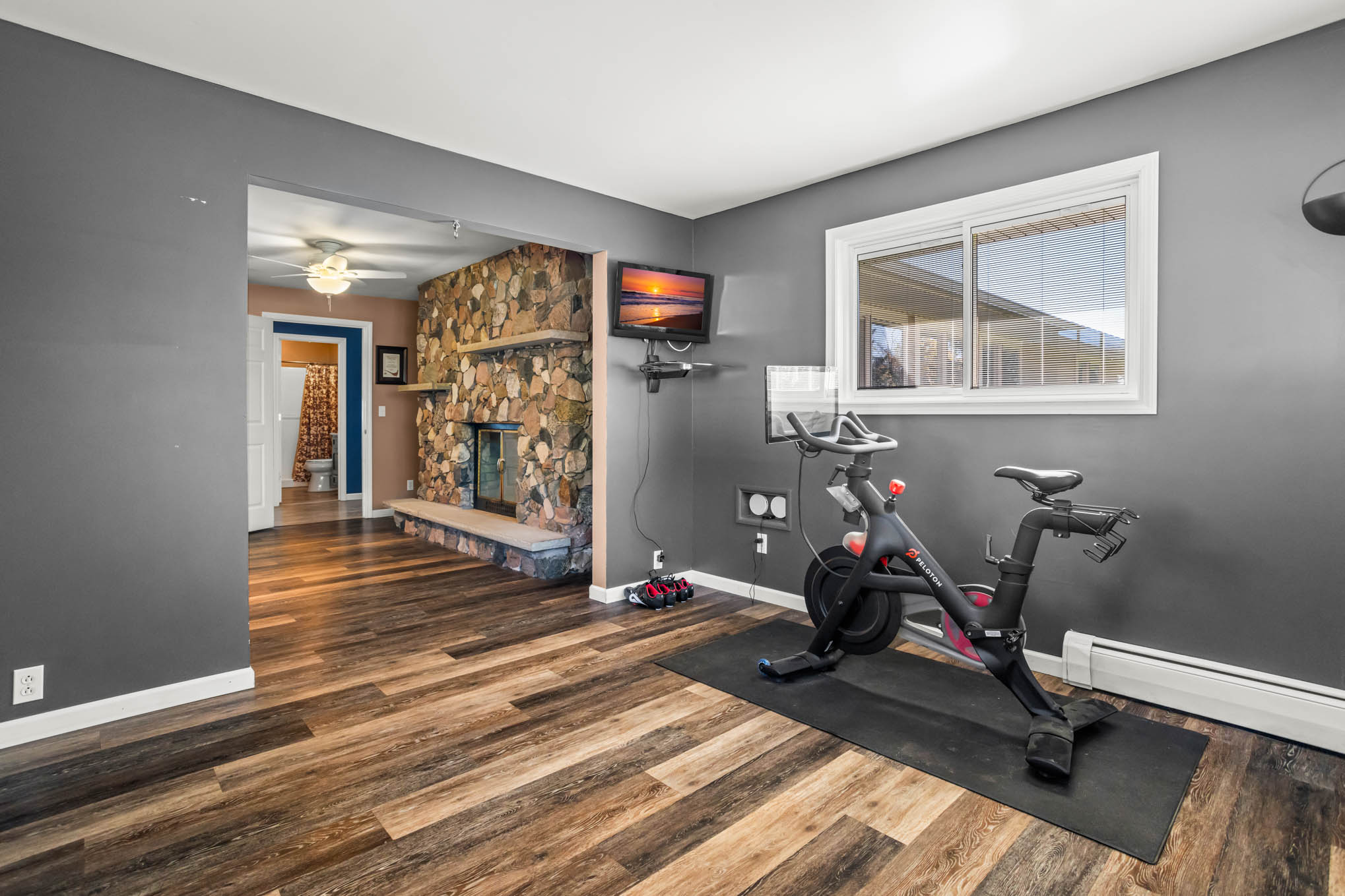 Exercise room looking toward fireplace